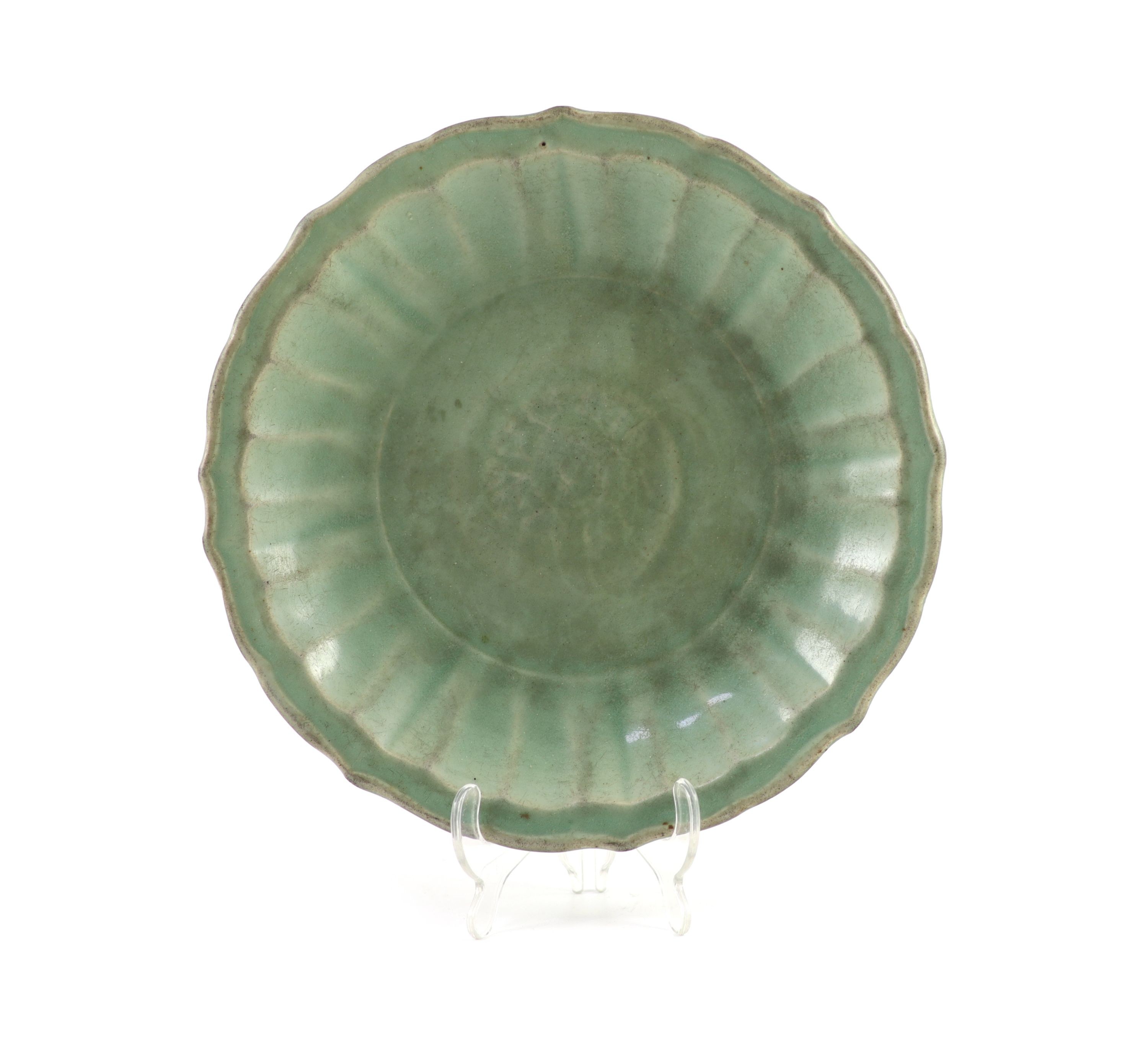 A Chinese Ming Longquan celadon dish, 15th/16th century, 30.5 cm diameter, glaze worn